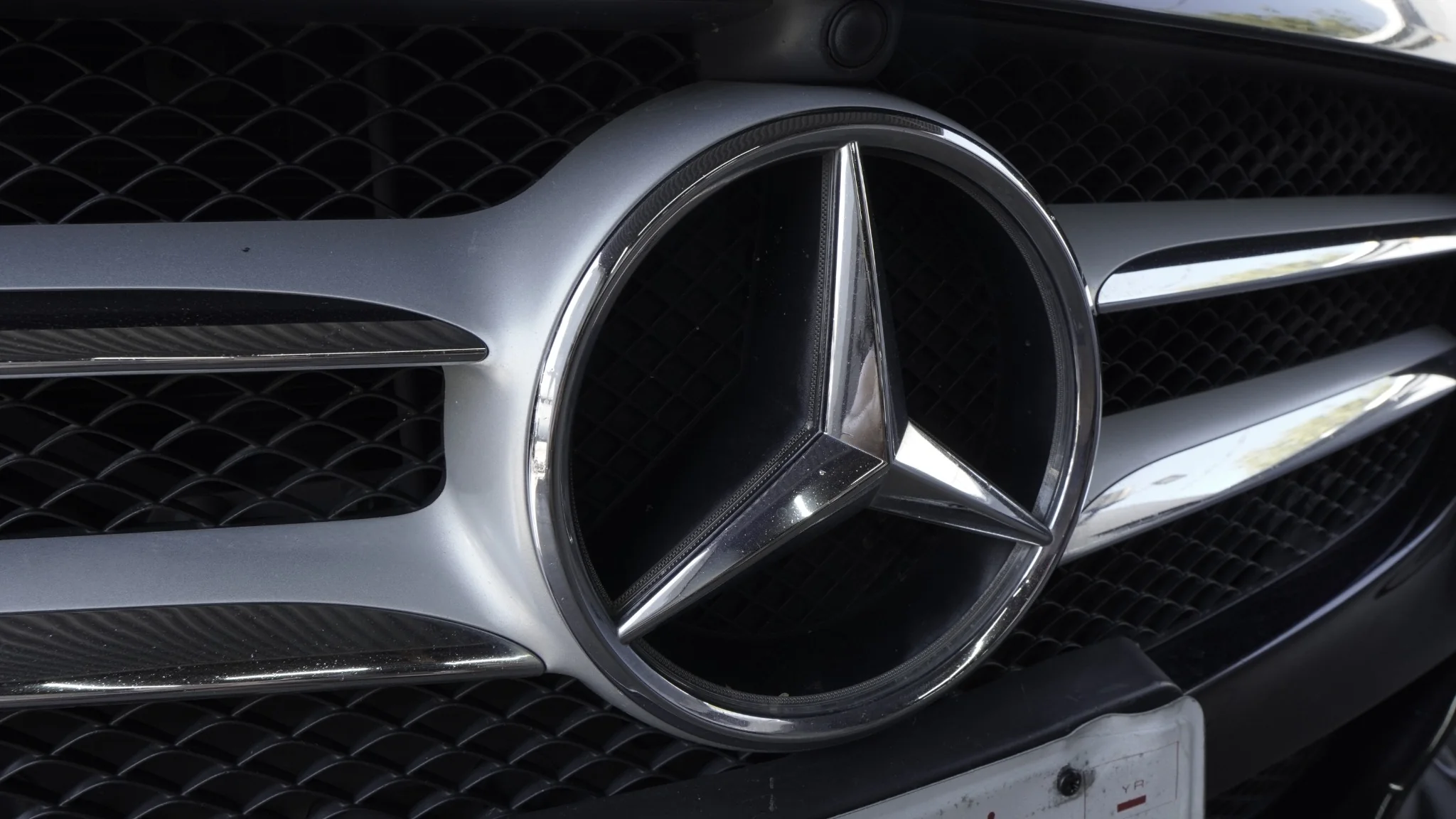 Close-up of Mercedes-Benz grille emblem on a vehicle at Silver Star Autohaus