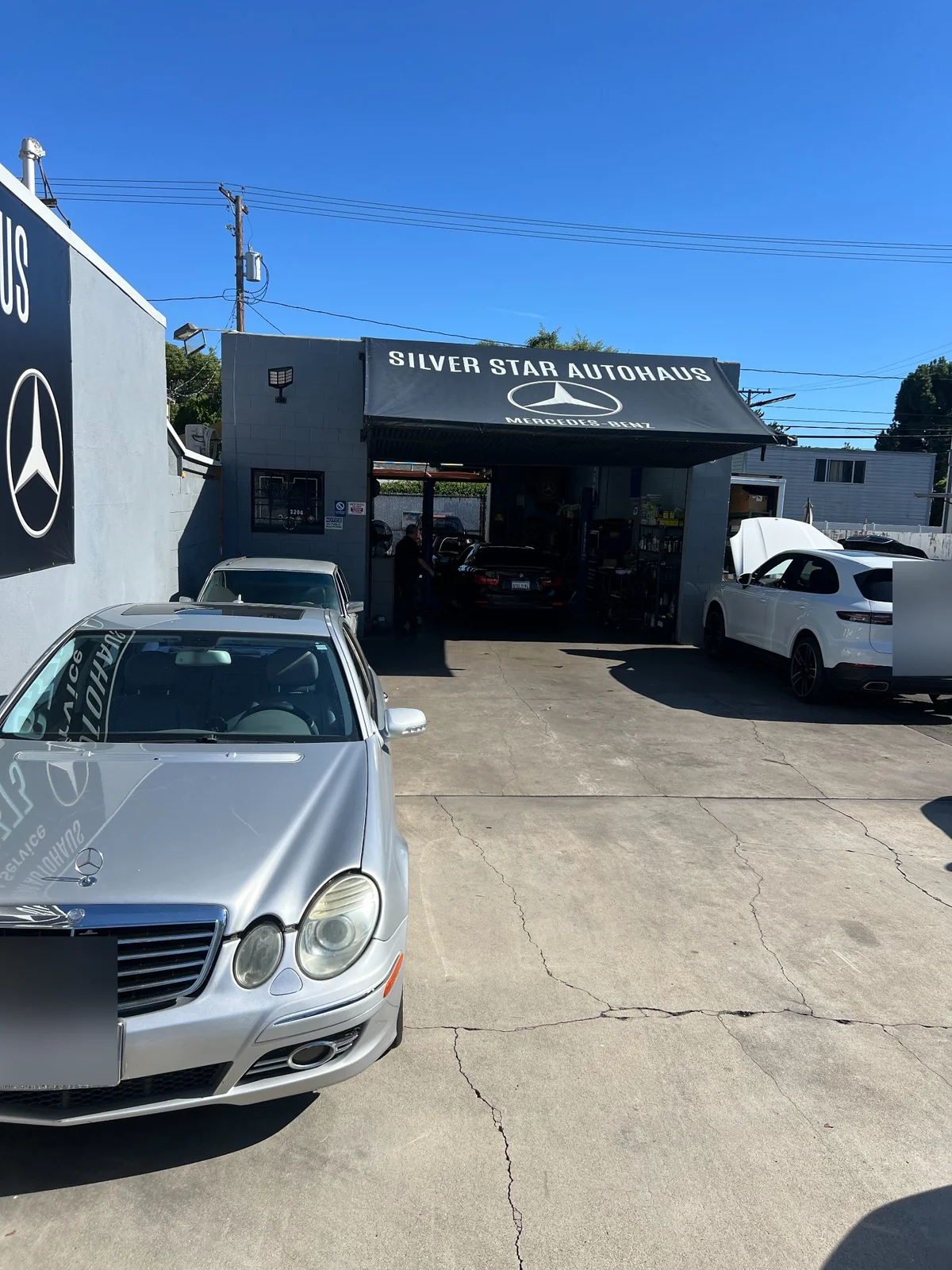 Silver Star Autohaus front entrance and service bays with customer vehicles in Burbank