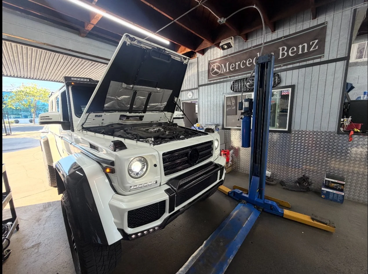 Mercedes-Benz G-Class undergoing service with hood open inside Silver Star Autohaus in Burbank